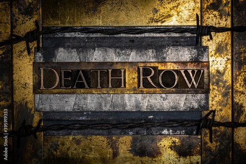 Death Row text lined with barbed wire on grunge lead with textured copper and gold background