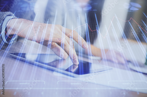 Double exposure of forex graph drawing and man and woman working together holding and using a mobile device. Trade concept.