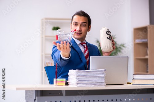 Young male employee working in the office