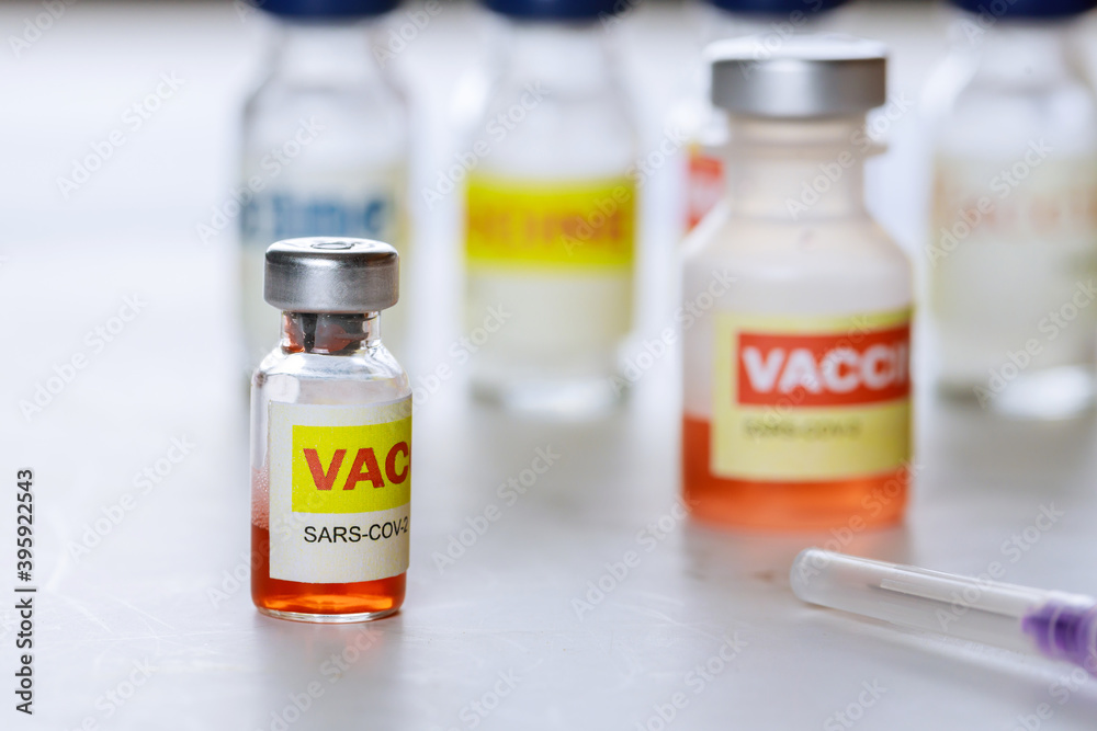 To fight the coronavirus pandemic covid-19 SARS-COV-2 vaccine bottle vaccination glass containers To fight the coronavirus pandemic covid-19 SARS-COV-2 vaccine bottle vaccination glass containers