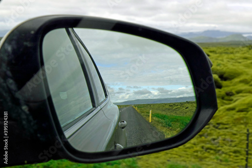 Reflection of the road in rear view mirror in Iceland 