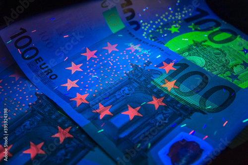 Euro currency in UV light protection.Euro in UV light.Euro currency in UV light protection.