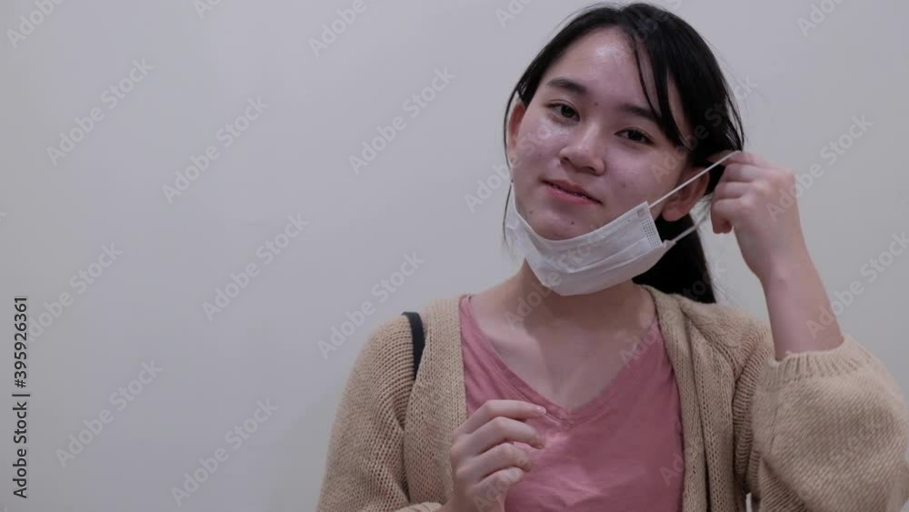 Asian teen protective mask and looking to camera on white background, health care concept , Asian teen protective mask and looking to camera on white background, health care concept ,