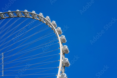 Photography Dubai Ain Ferris wheel against blue sky