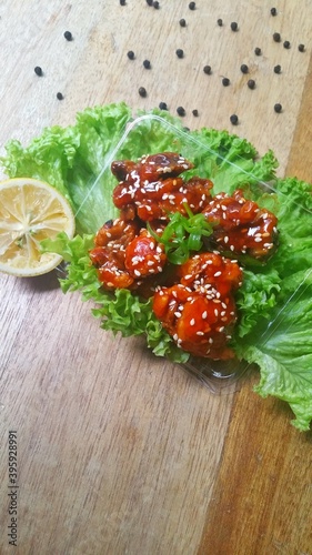 fried korean chicken with fresh green vegetable lettuce