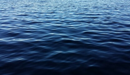 Dark blue water background with soft waves on Florida river