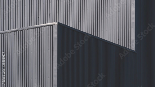 Sunlight and shadow on surface of gray corrugated metal factory building wall in perspective view