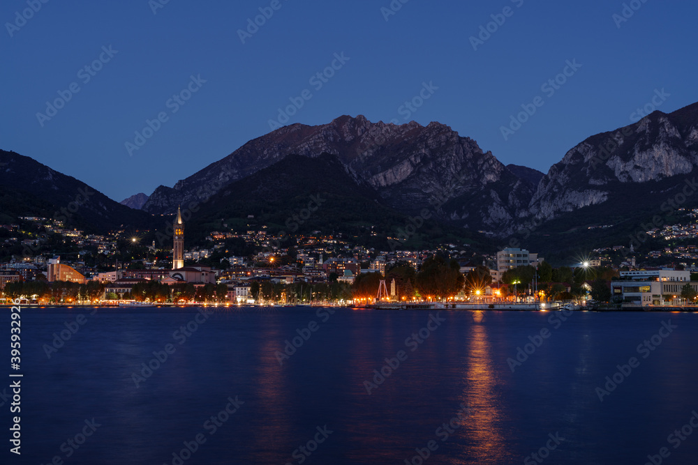 Night view from the lakefront promenade in Lecco on Lake Como, Northern Italy