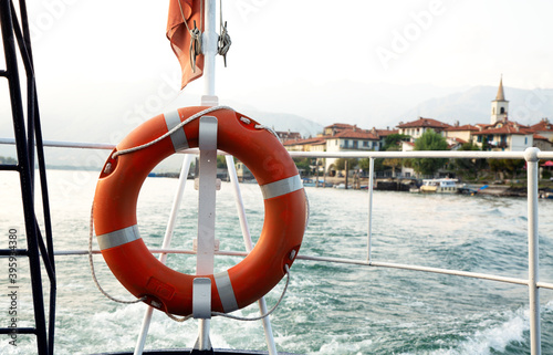 life buoy pending from banister of a ship