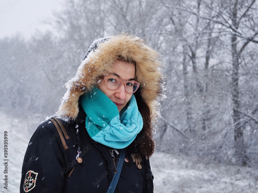 Young woman in warm clothing in wintertime Young woman in warm clothing in wintertime