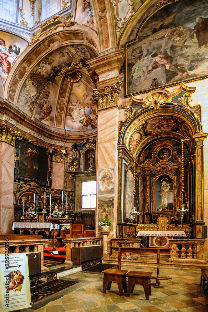 Fototapeta premium The island of San Giulio on Lake Lago d, Orta is famous for the Basilica of St. Julius with frescoes from the 14th to 16th centuries and the only street of Silence that encircles the entire island. 