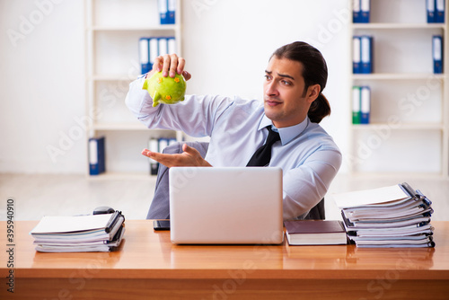 Young male employee in payment concept © Elnur