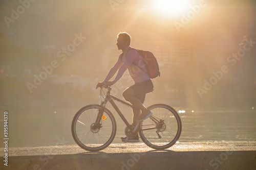 man cyclist ride on bicycle outdoors near the sea