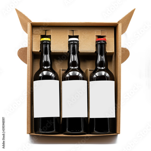 Mockup of three beer bottles inside a cardboard box