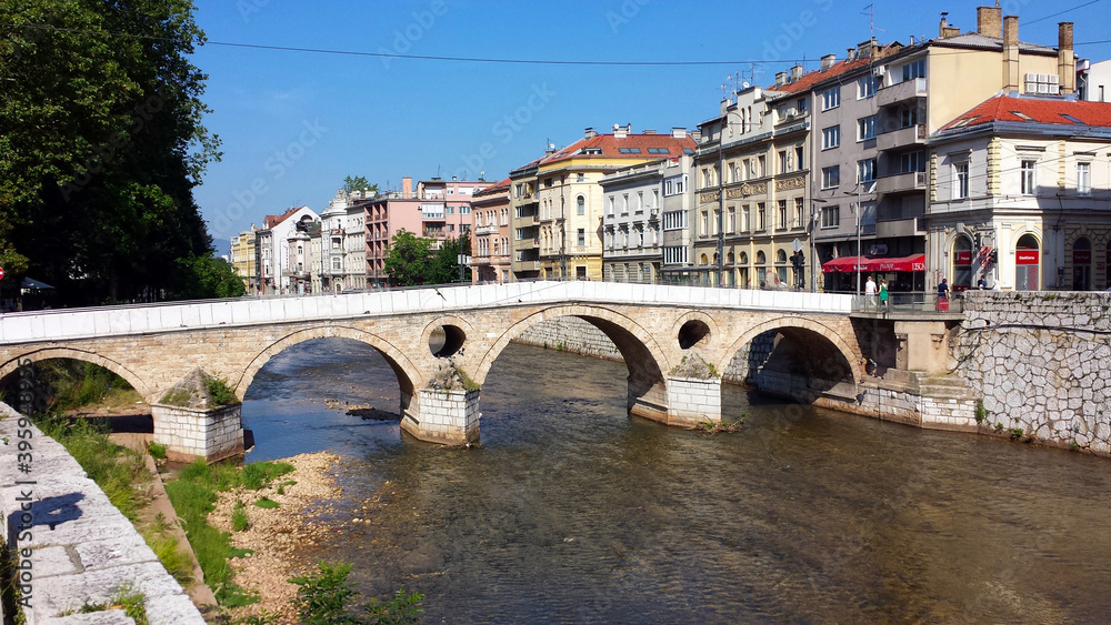 Sarajevo, Bosnia and Herzegovina - June 25, 2017: Latin Bridge and the houses on the river in Sarajevo.