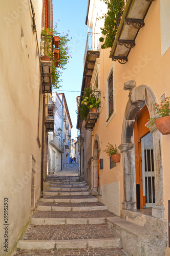 Fototapeta Naklejka Na Ścianę i Meble -  A narrow street with among the old houses of Rivello, a medieval village in the Basilicata region.