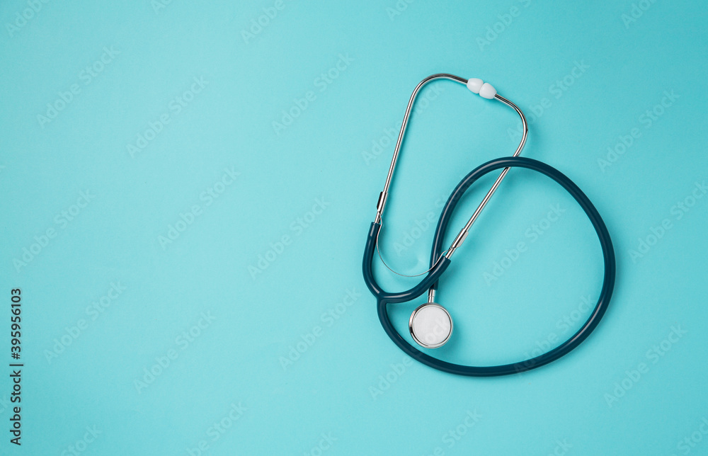 Top view of stethoscope on a blue background. Concept of medicine and health. Top view of stethoscope on a blue background. Concept of medicine and health.