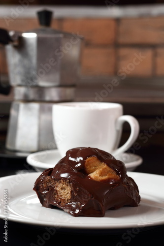Choux with chocolate ganache and coffee cup