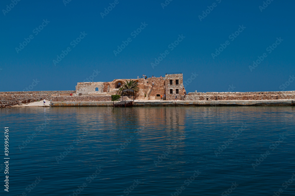 sea and waves on the surface and rocks and mountains during the day is blue sky in the sky clouds in greece sea and waves on the surface and rocks and mountains during the day is blue sky in the sky clouds in greece