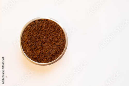 Ground coffee in the left