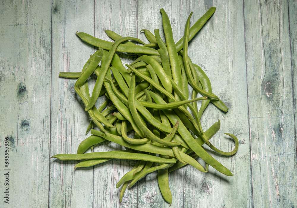 Rustic image of green beans on a wooden background Rustic image of green beans on a wooden background