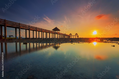 A long exposure picture of majestic sunrise with a jetty as a background at Tanjung Balau, Johore © hamdie