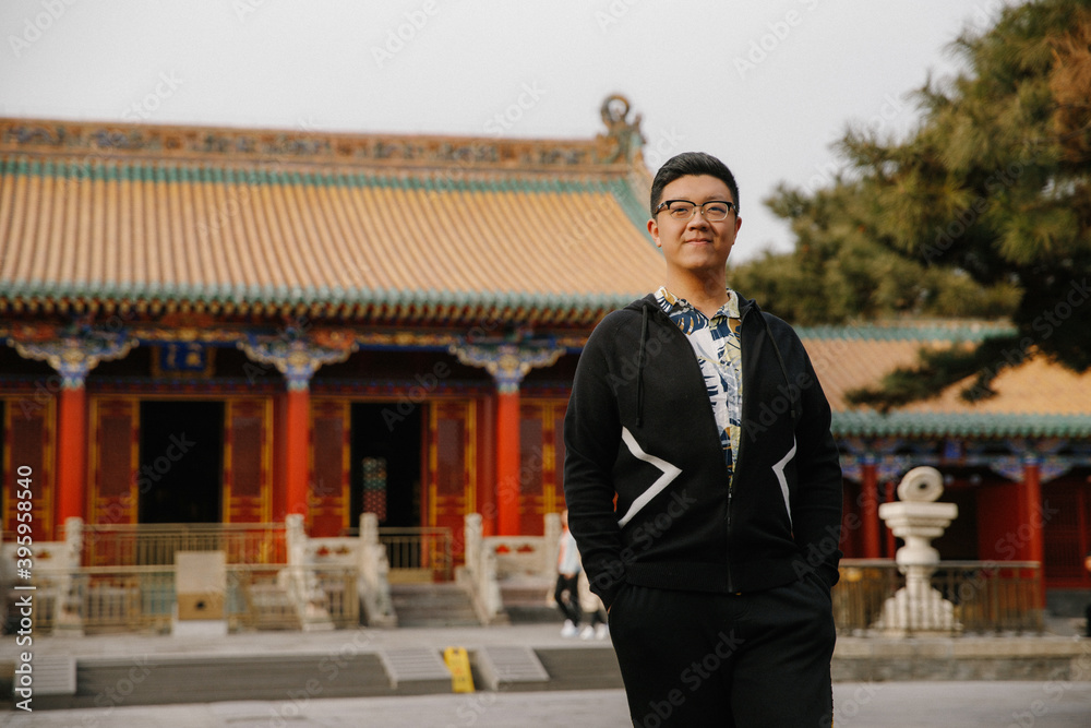 Φωτογραφία Asian man walking in the Mukden Palace (Shenyang Imperial Palace or Gu Gong) in