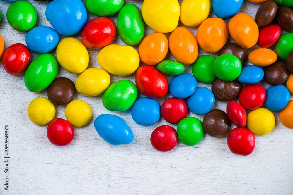 M&M's candy on the white background, colorful candy, multicolored gradient M&M's candy on the white background, colorful candy, multicolored gradient