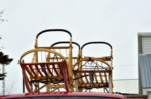 Three sleds use in sled dog travel  often a winter sport for leisure or competitive racing. Sleds are trasported on truck roof.