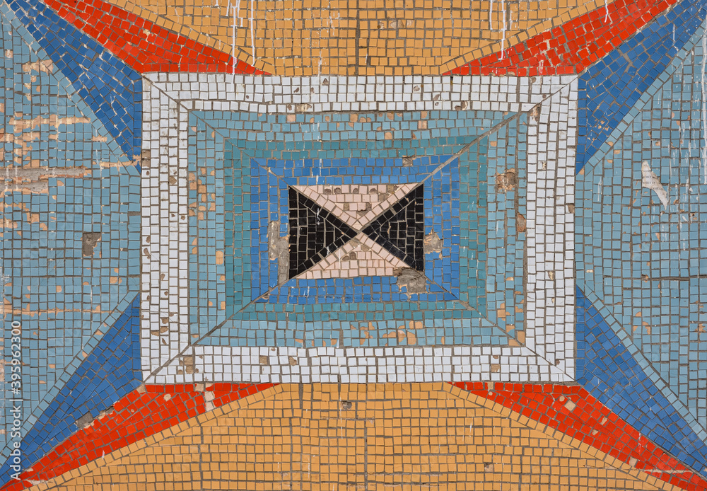 colored mosaic and square tile pattern on the old wall. decorative mosaic of different colors colored mosaic and square tile pattern on the old wall. decorative mosaic of different colors
