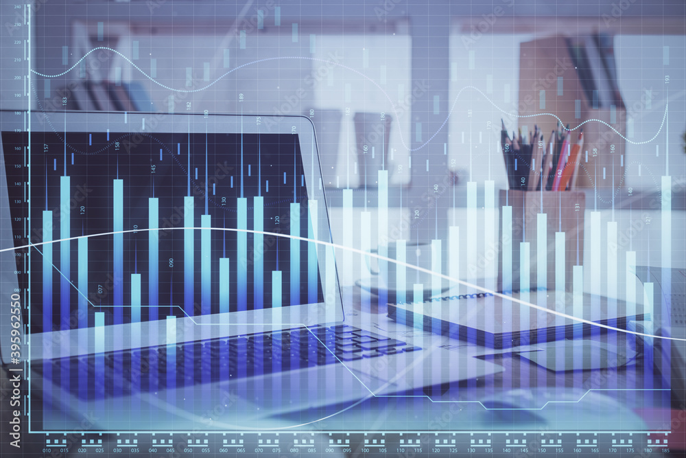 Forex market chart hologram and personal computer background. Double exposure. Concept of investment. Forex market chart hologram and personal computer background. Double exposure. Concept of investment.