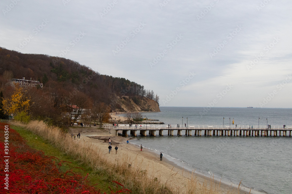 pier on the beach pier in the gray autumn day 