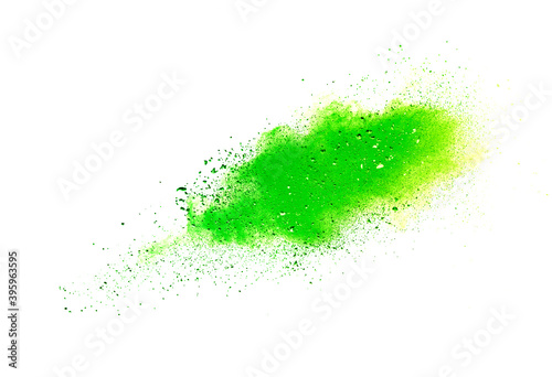 Freeze motion of green color powder exploding on white background.