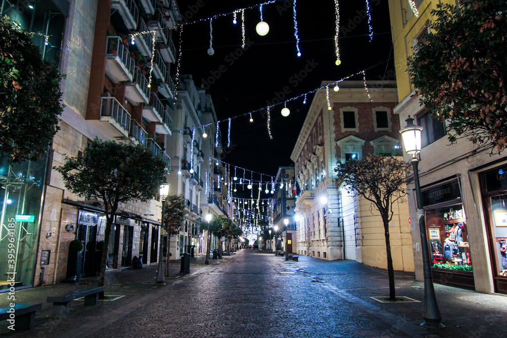 artist lights in an empty city. Christmas in a deserted city. Salerno Italy