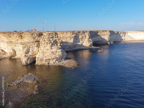 Tarhankut Cape with turquoise water on the western coast of Crimea peninsula. Summer seascape, famous travel destination. Picturesque seascape, Crimea coast beach The Black sea Yalta mountains.