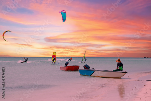 Watersports at Palm Beach on Aruba island in the Caribbean Sea at sunset