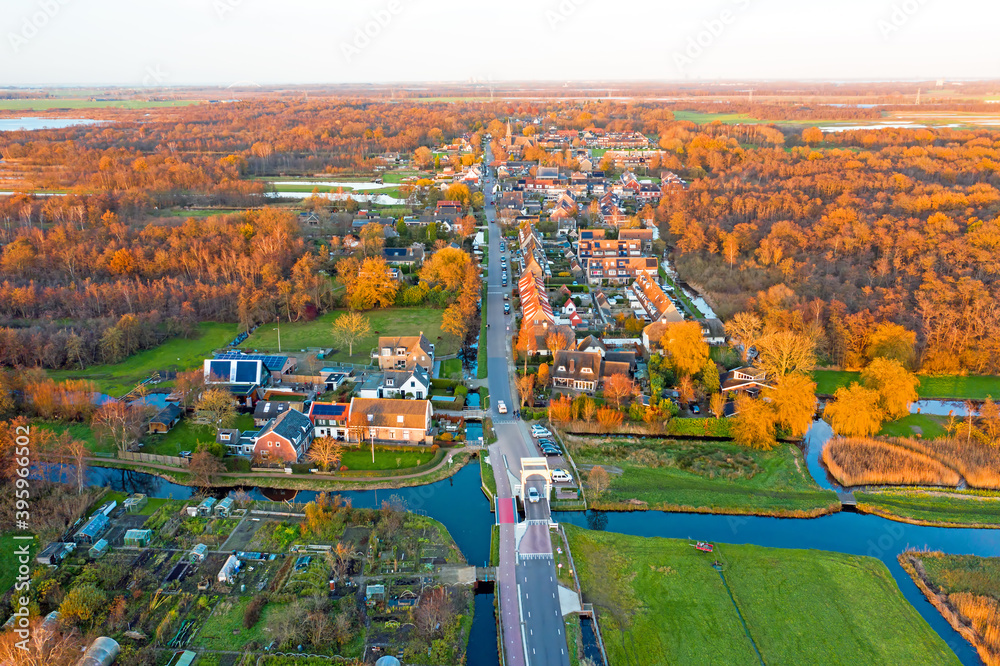 Aerial from the village Ankeveen in the contryside in the Netherlands in fall