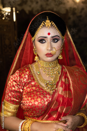 Portrait of very beautiful surprised Indian bride closeup. Concept of human emotions