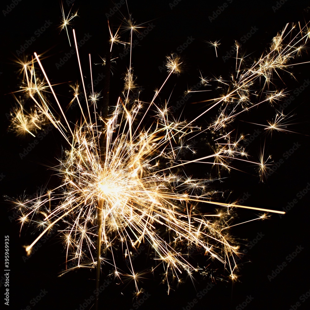 Beautiful Christmas - New Year background with sparkler and colorful lights. Beautiful Christmas - New Year background with sparkler and colorful lights.