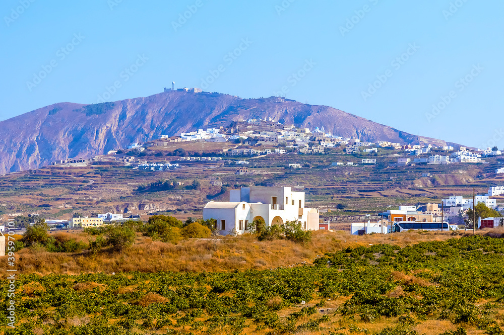 The view from Megalochori across vineyards towards Mount Profitis Ilias in Santorini in summertime