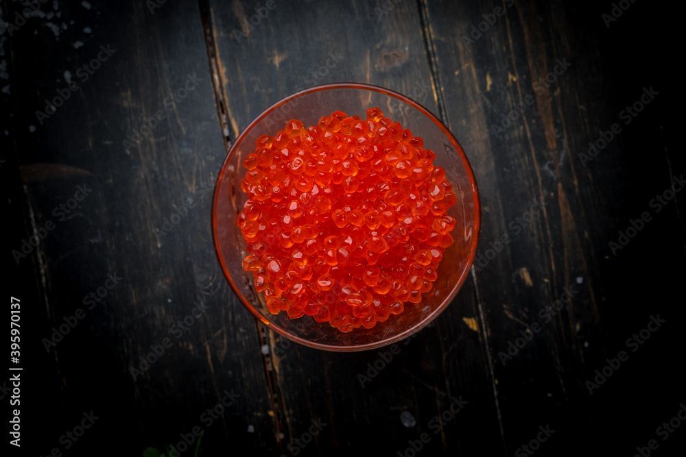 Chum salmon caviar in a glass bowl . Seafood, delicacies, healthy nutrition. Chum salmon caviar in a glass bowl . Seafood, delicacies, healthy nutrition.