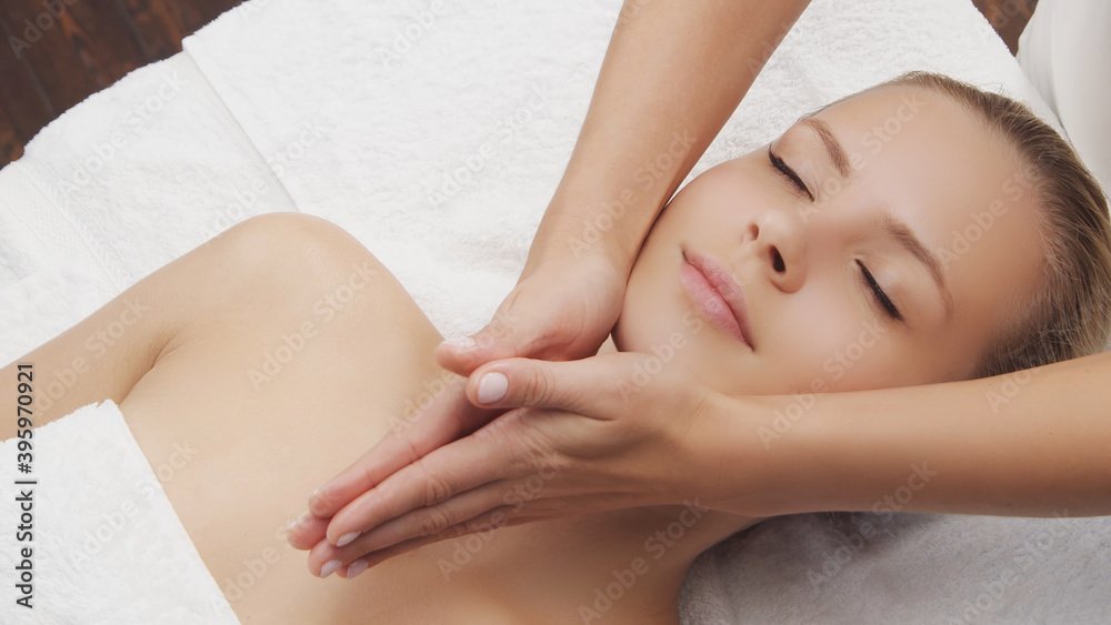 Young, beautiful and healthy woman in massaging salon. Traditional face massage therapy and skin care. Young, beautiful and healthy woman in massaging salon. Traditional face massage therapy and skin care.