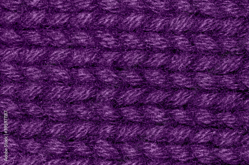 close up macro of amethyst orchid color wool warm cosy sweater