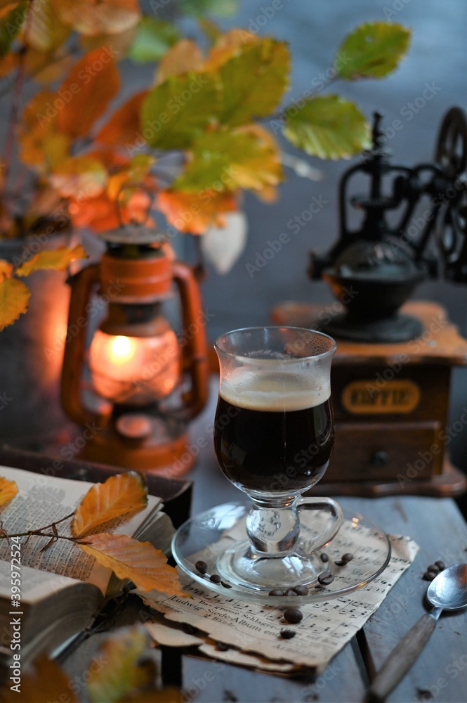 Autumn leaves, Coffee Grinder and cup of black coffee. Background for website, bloggers, social media. 