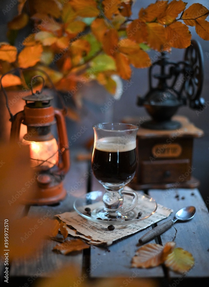 Autumn leaves, Coffee Grinder and cup of black coffee. Background for website, bloggers, social media. 