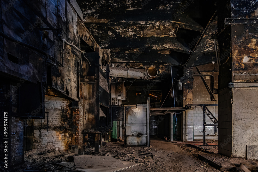 Burnt interior of industrial building or warehouse. Consequences of fire