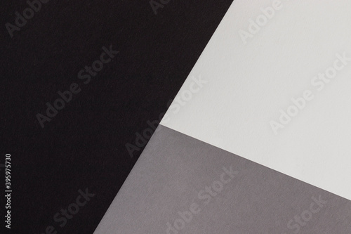 Abstract geometric paper background. Black, white and gray colors.