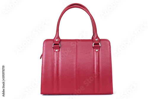 red womens designer handbag on a white background, back view