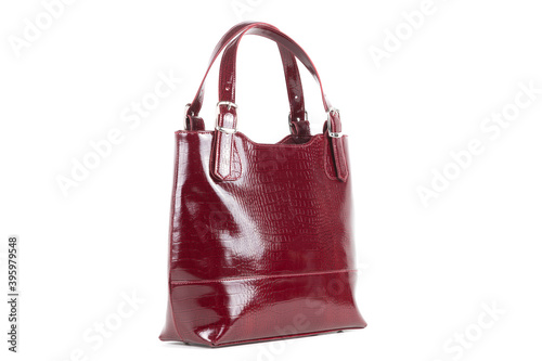 red stylish ladies leather bag on a white background