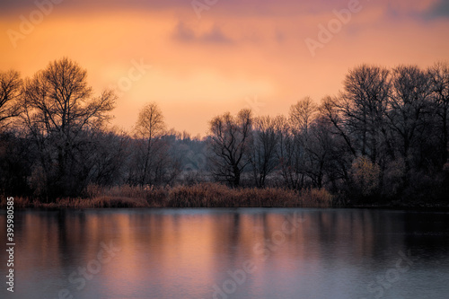 Island on the river in winter. Cold sunrise